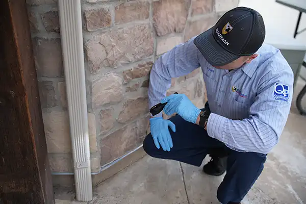 Guardian Pest Control technician inspecting a Utah home to ensure ongoing pest protection and guaranteed results.