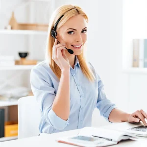 Guardian Pest Control office employee answering the phone at the Utah office to assist customers.